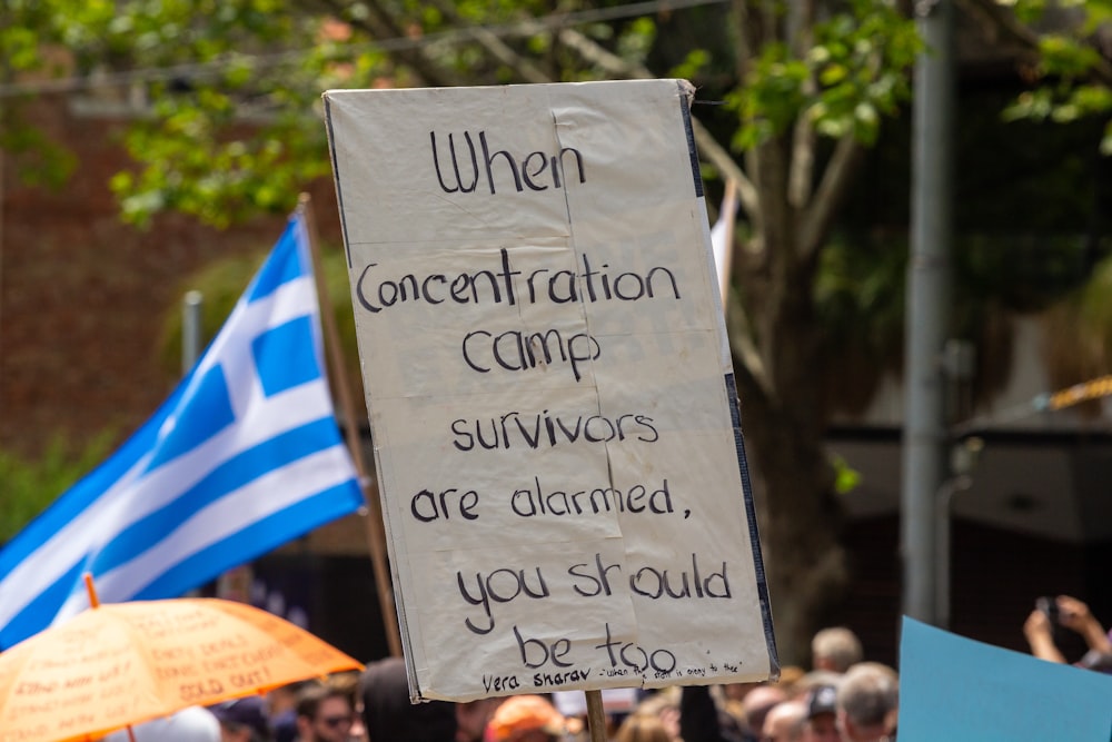 a protest sign with a message written on it