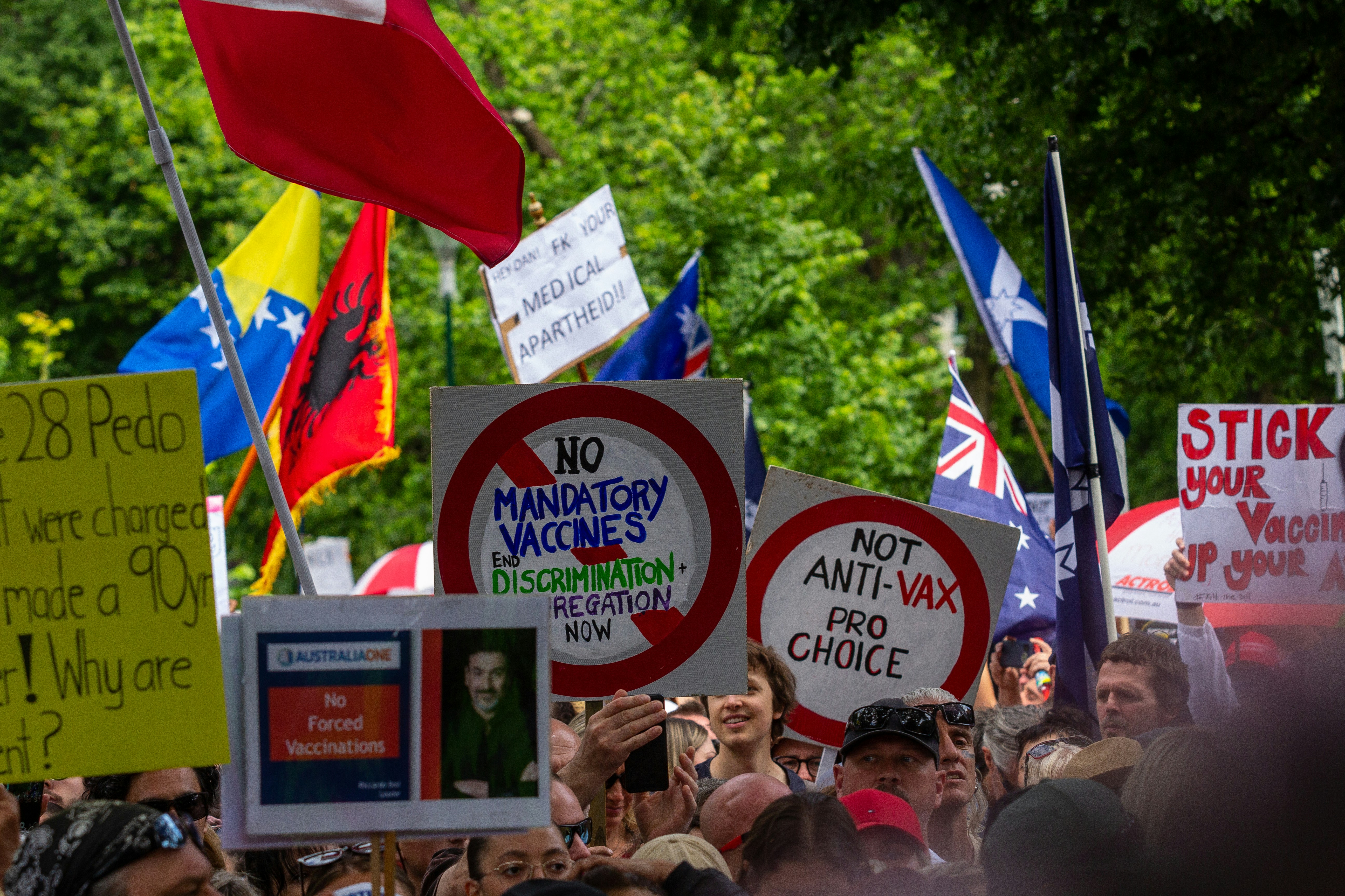Melbourne's Freedom protests rally and march in the city November 20th 2021 - over 200,000 people marched from Parliament to the Flagstaff Gardens. A happy family friendly crowd singing and chanting \