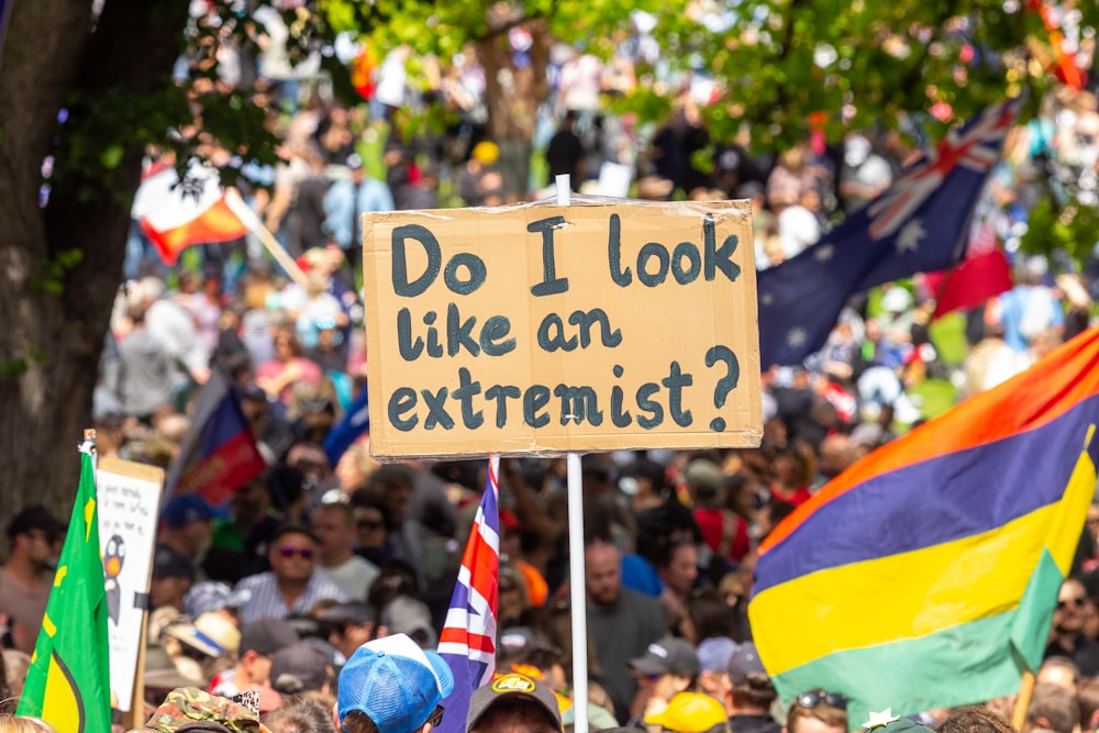 a protest with a sign that says do i look like an extremist?