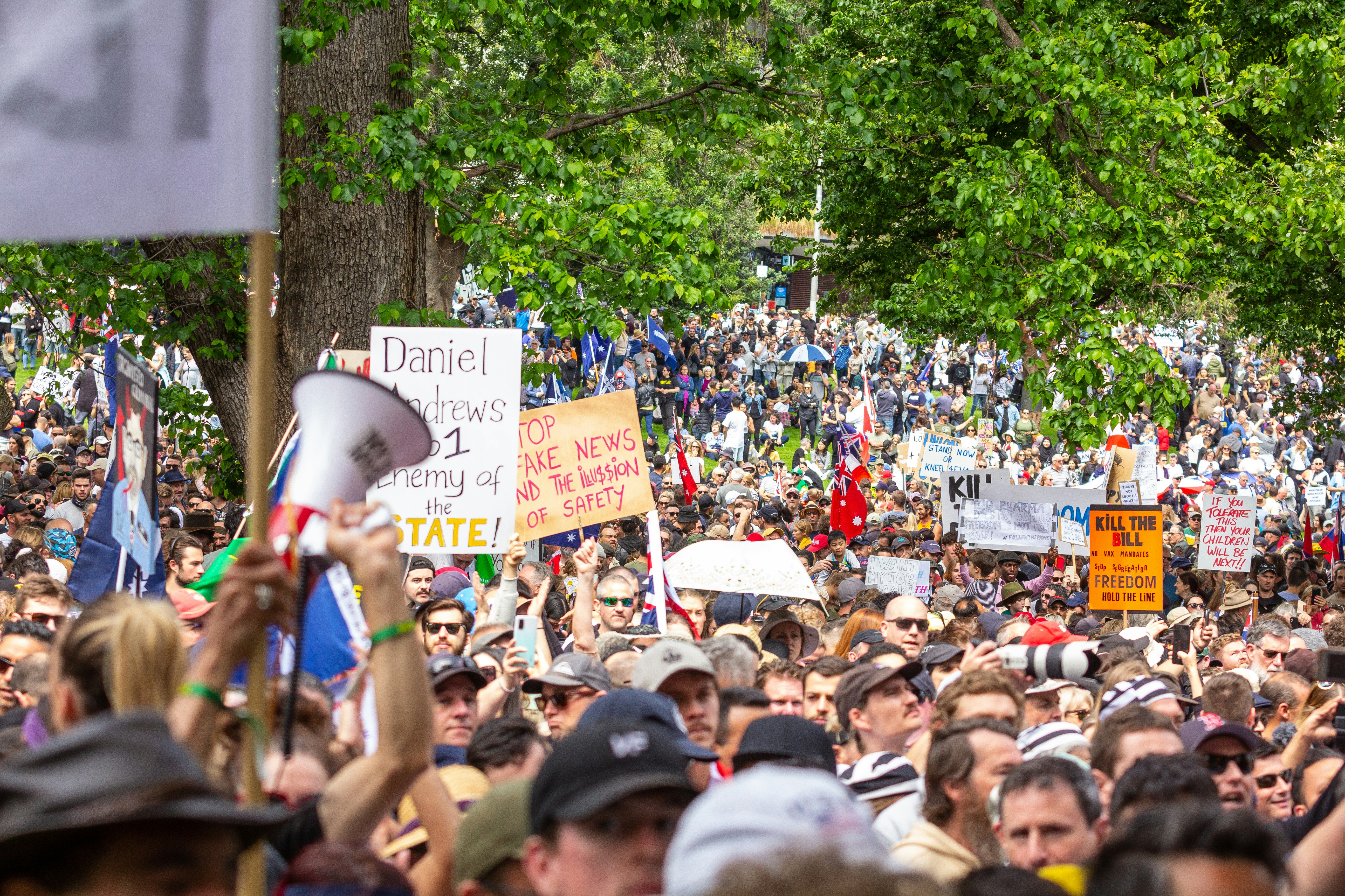 Melbourne's Freedom protests rally and march in the city November 20th 2021 - over 200,000 people marched from Parliament to the Flagstaff Gardens. A happy family friendly crowd singing and chanting \