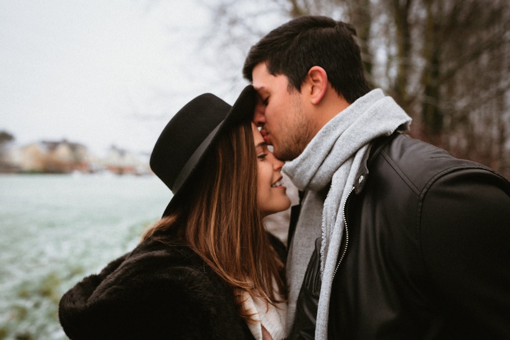 a man and a woman standing next to each other