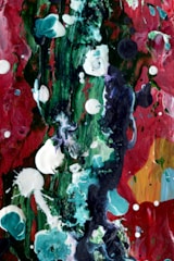 A colorful acrylic painting featuring abstract shapes and textures on a canvas.