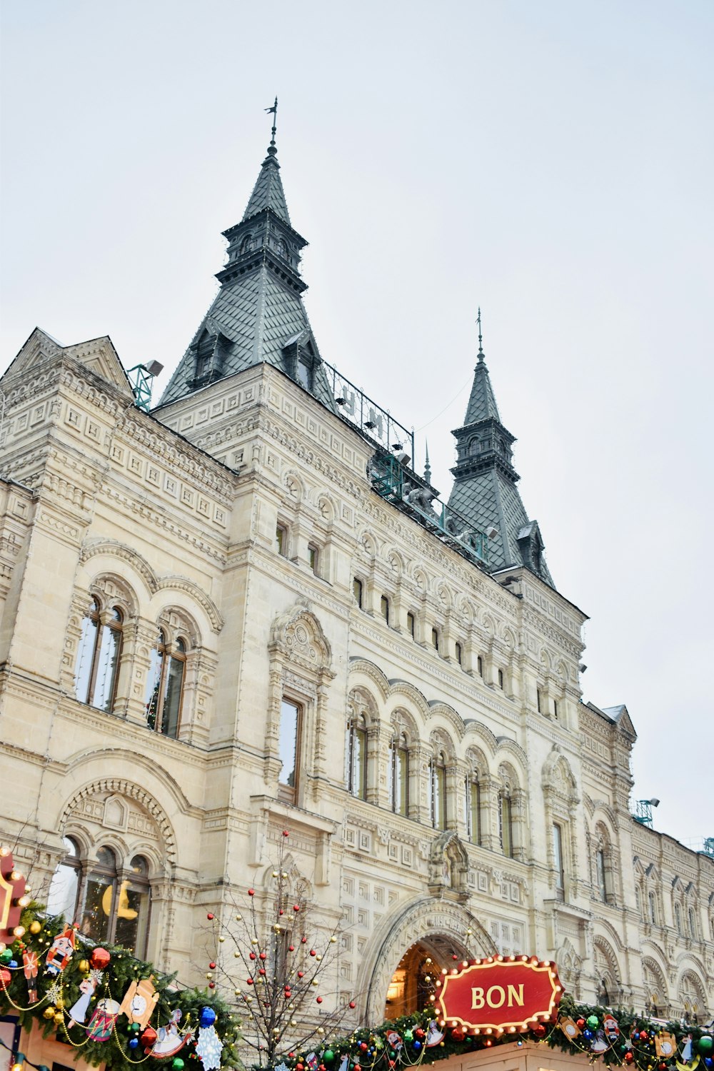 a large building with a christmas display in front of it