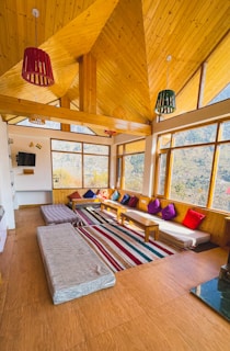 Comfortable seating area in a guest room with cozy textiles and a view of the northern landscape.