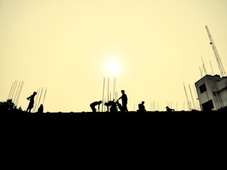 a group of people standing on top of a roof