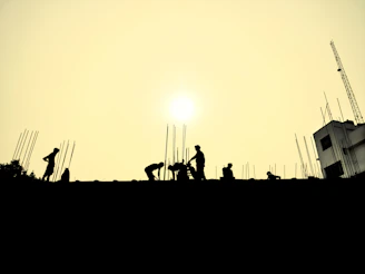 a group of people standing on top of a roof