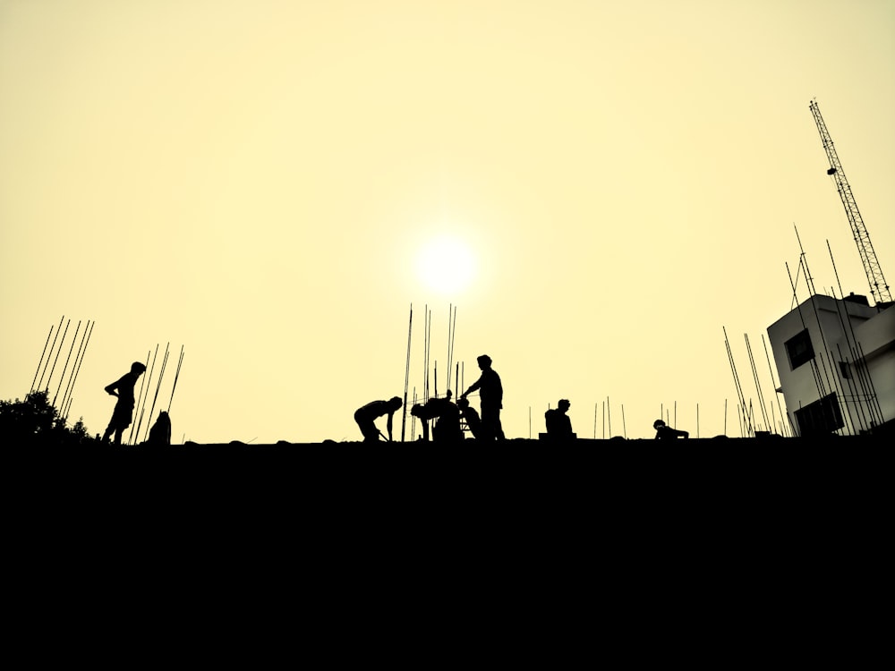 a group of people standing on top of a roof