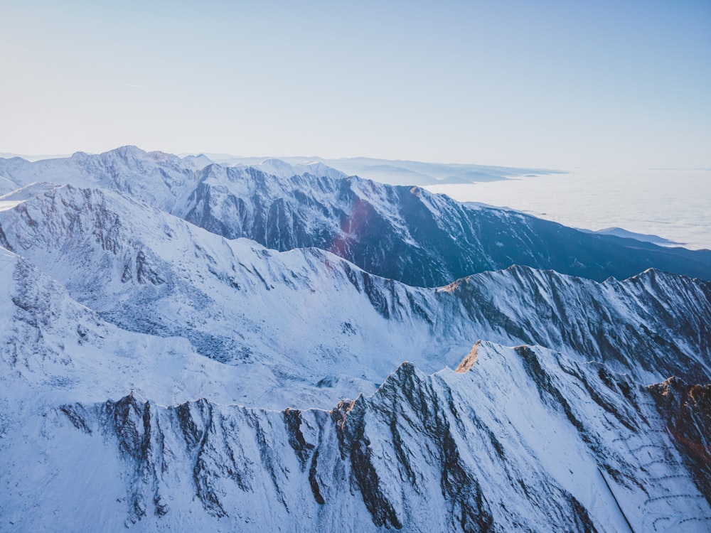 a view of a mountain range covered in snow