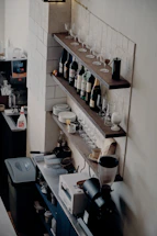 Cozy corner of a Tuscan kitchen with fresh ingredients and wine bottles on shelves