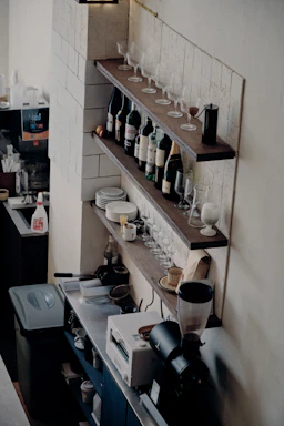 Cozy corner of a Tuscan kitchen with fresh ingredients and wine bottles on shelves