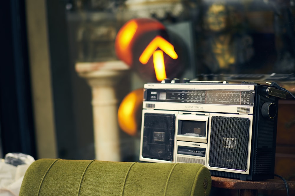 a radio sitting on top of a green chair