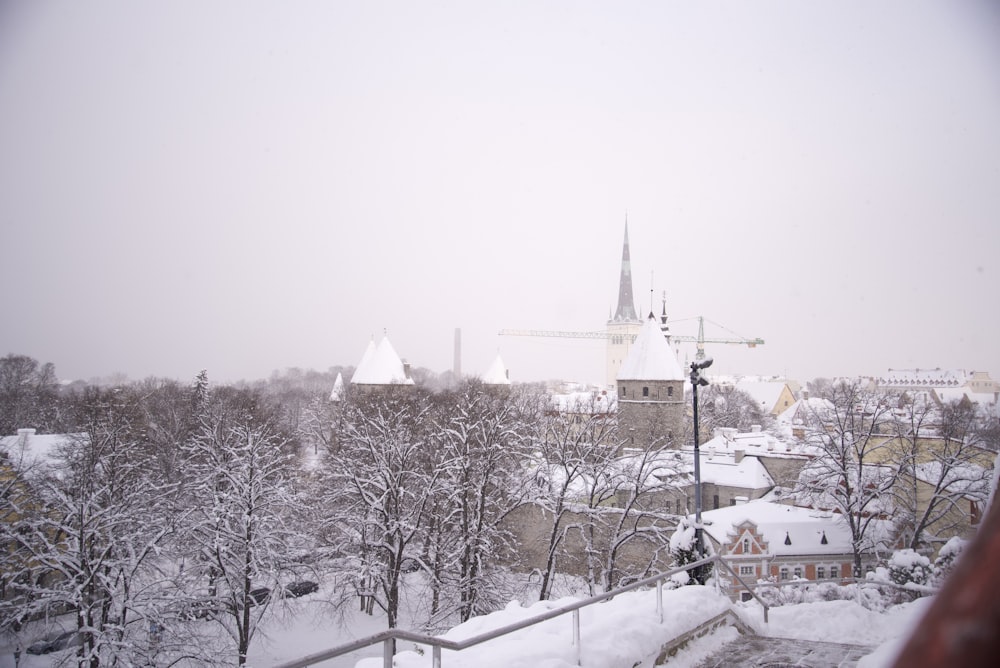 a view of a snowy city from a window