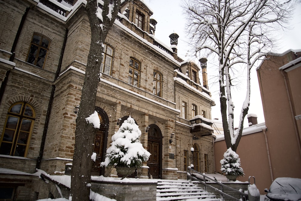 a large building with a lot of snow on the ground