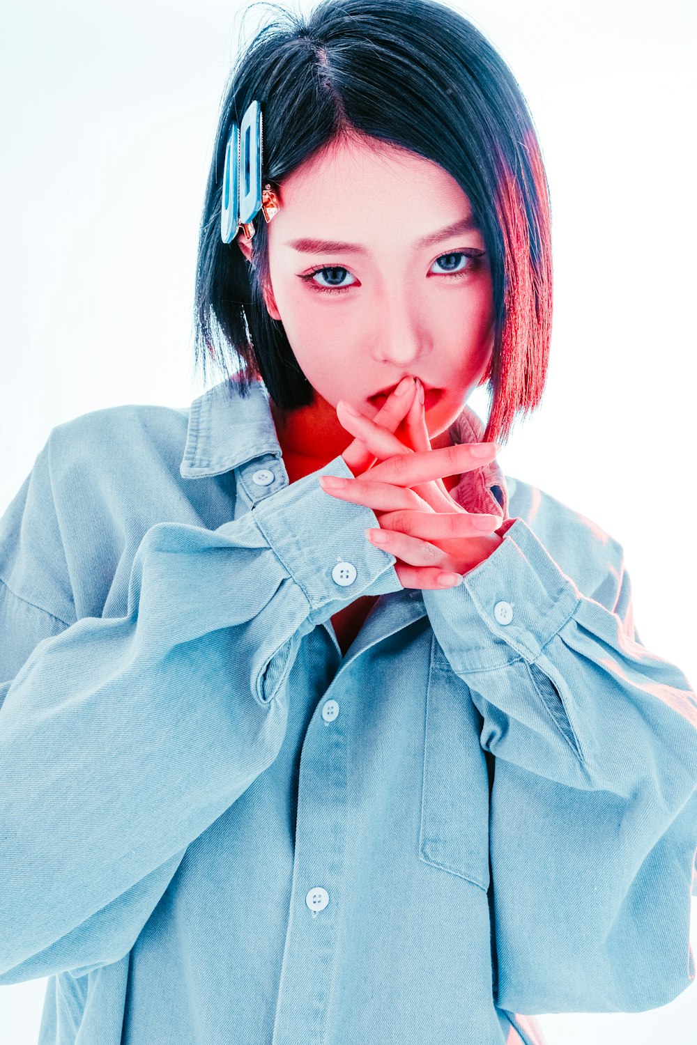 a woman in a blue shirt posing for a picture