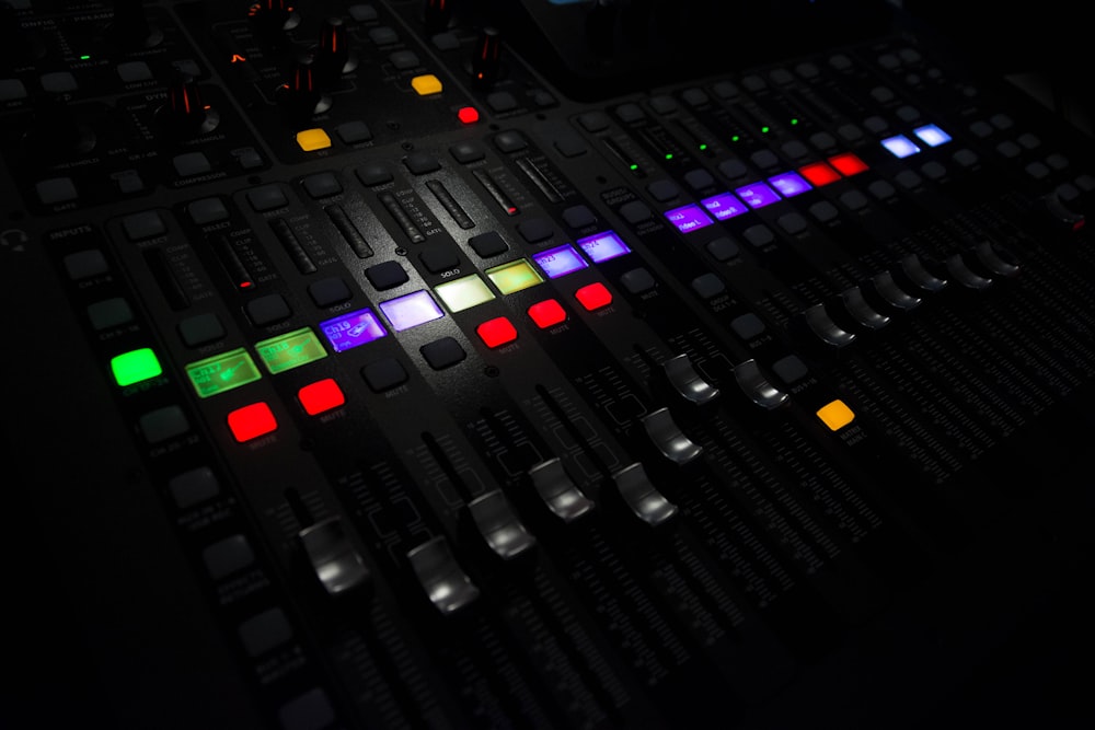 a close up of a sound board with many colors