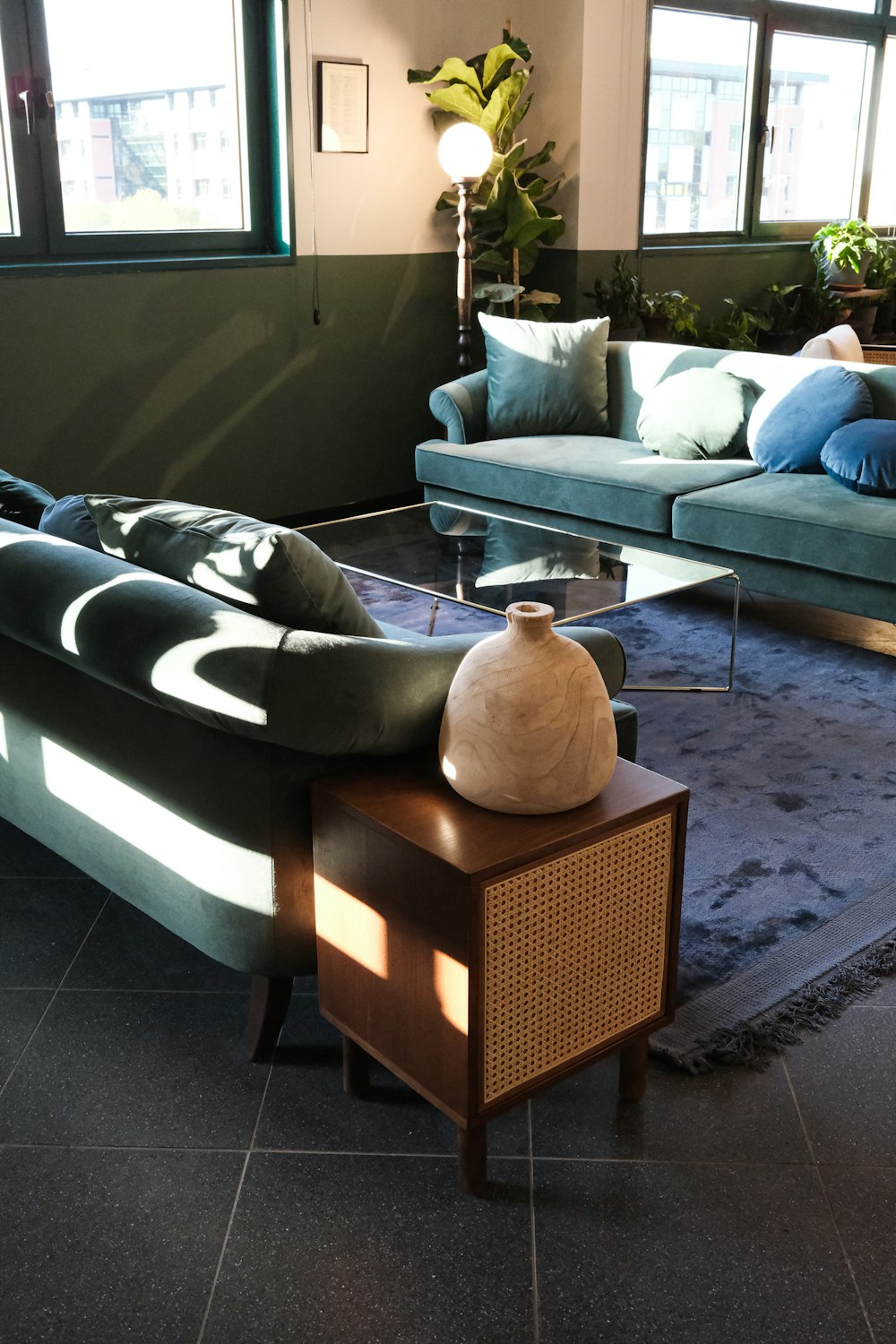 a living room filled with furniture and windows