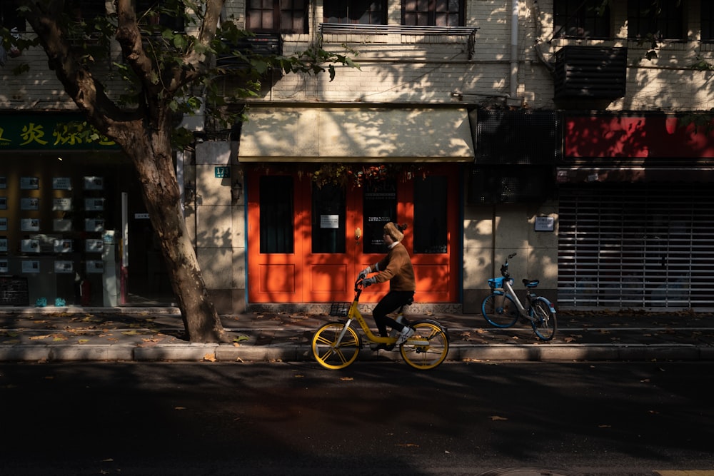 a person riding a bike down a street