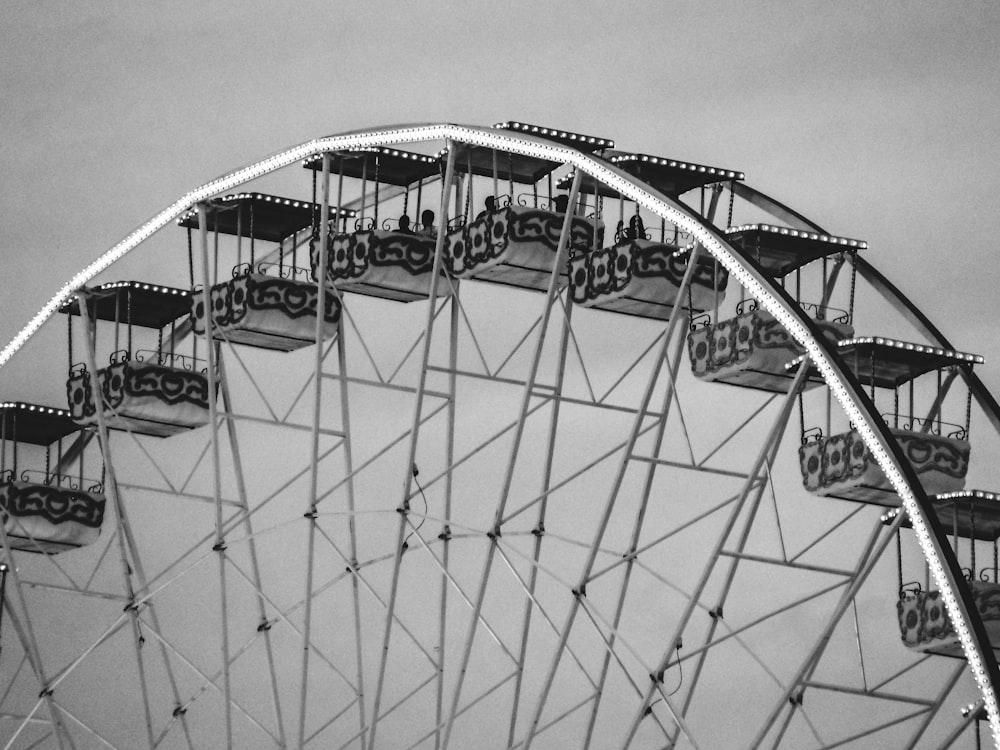 a ferris wheel in a black and white photo