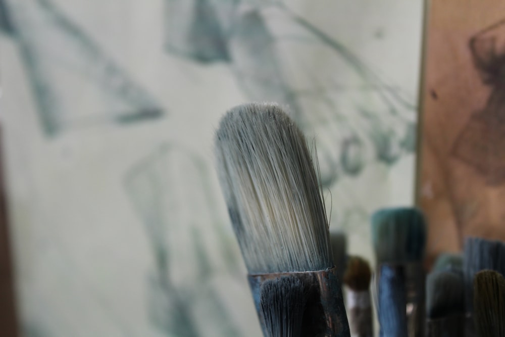 a close up of a brush and a drawing