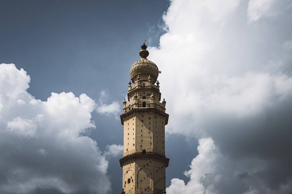 a tall tower with a clock on the top of it