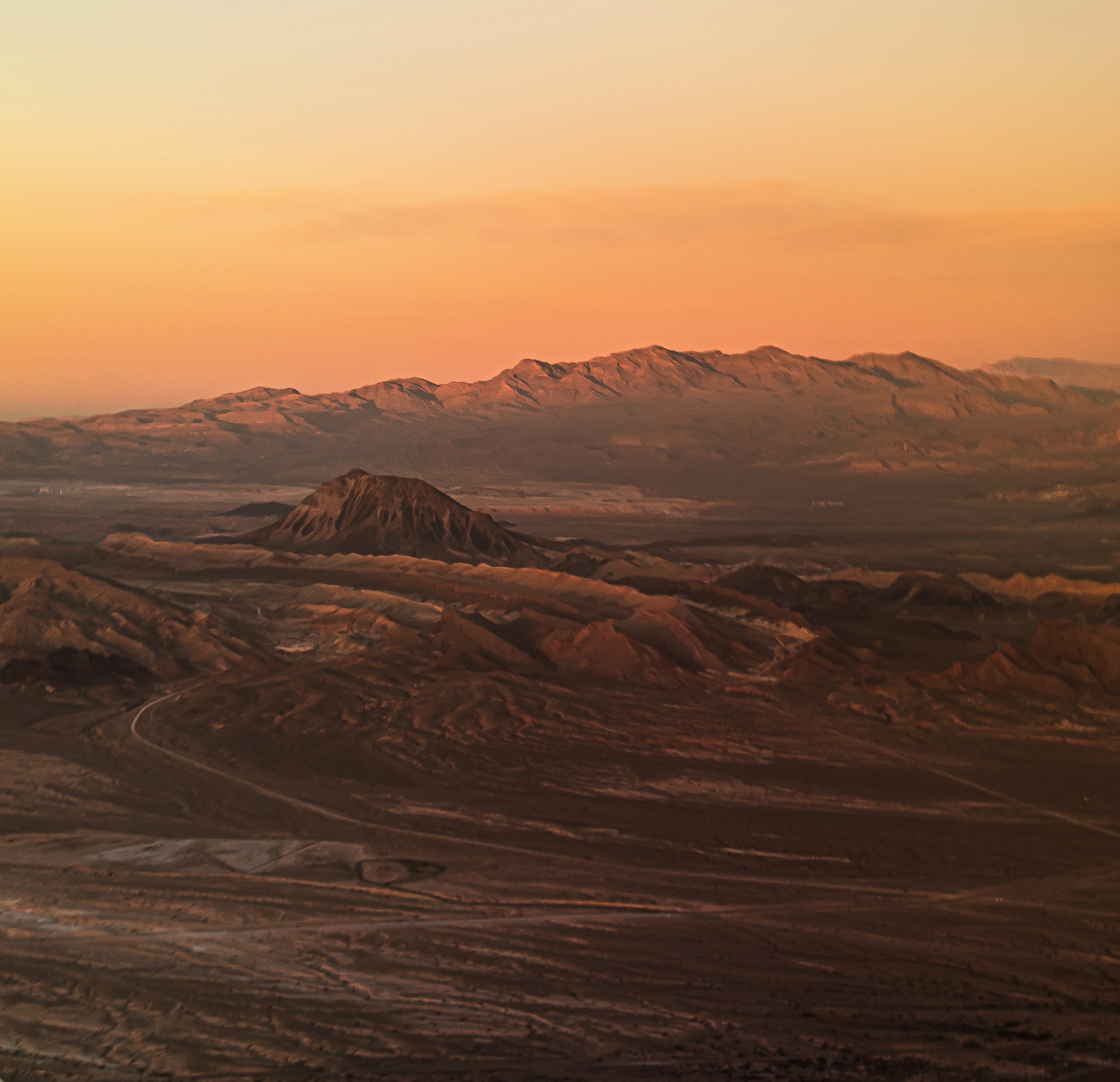 a view of a mountain range at sunset