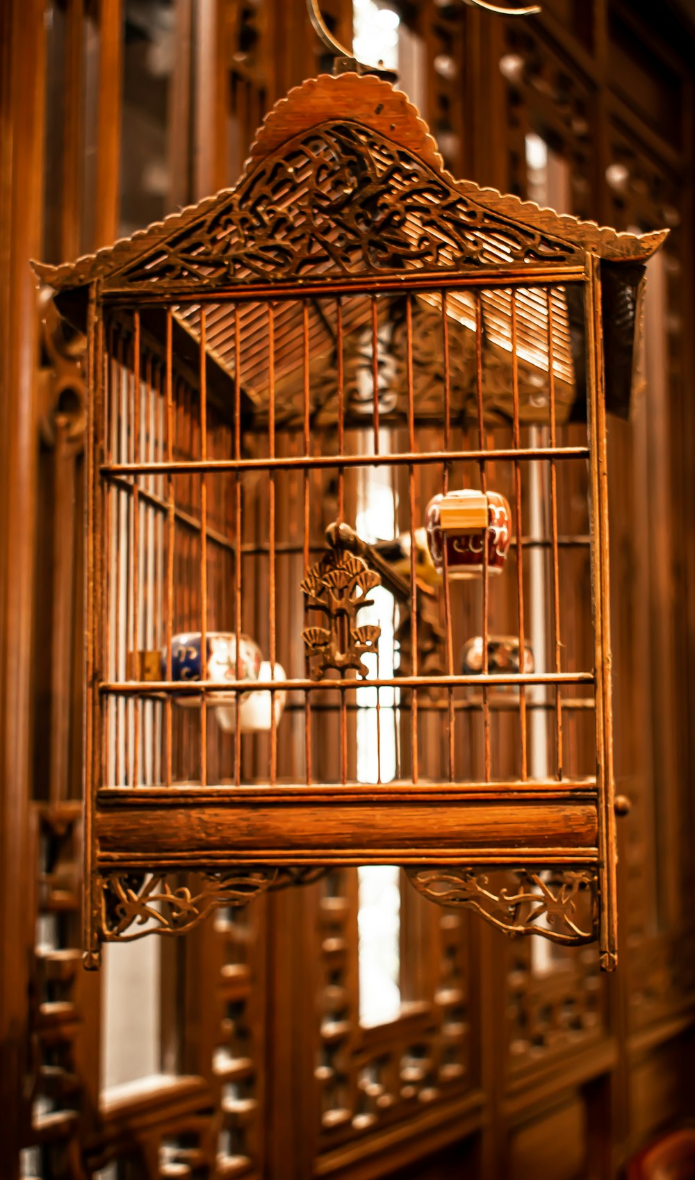 a bird cage with a bird inside of it