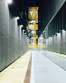 a long hallway with a clock on the side of it