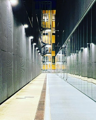 a long hallway with a clock on the side of it