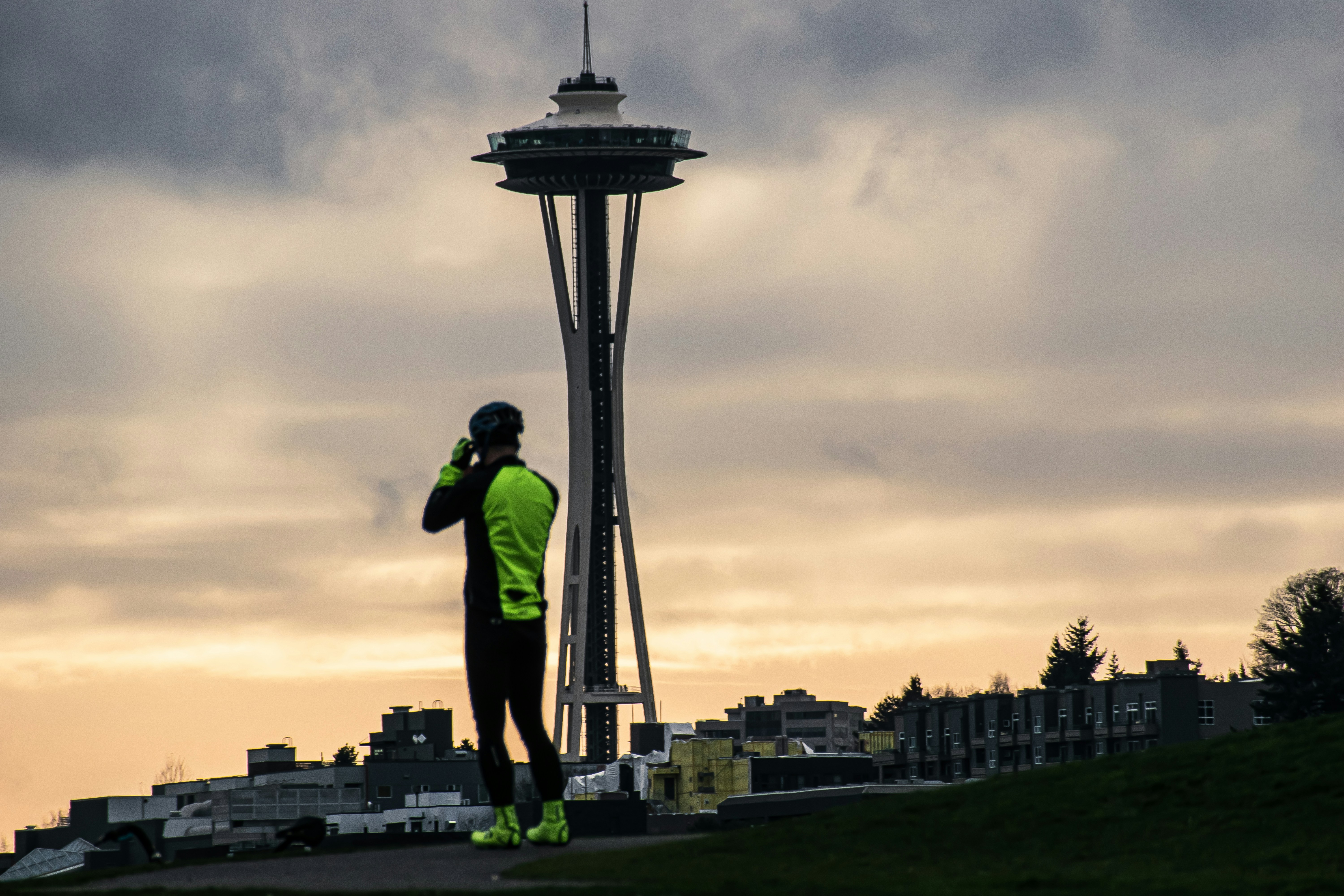 a man standing in front of a tall tower