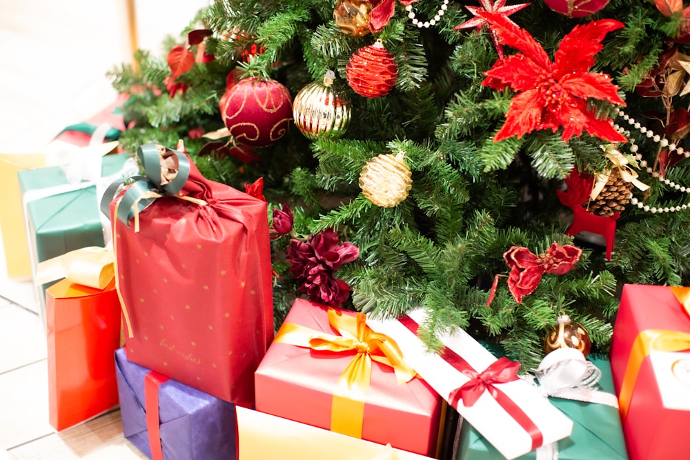 a christmas tree with presents under it