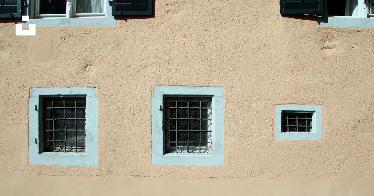 Three windows on the side of a building photo – Free Lindau Image on ...