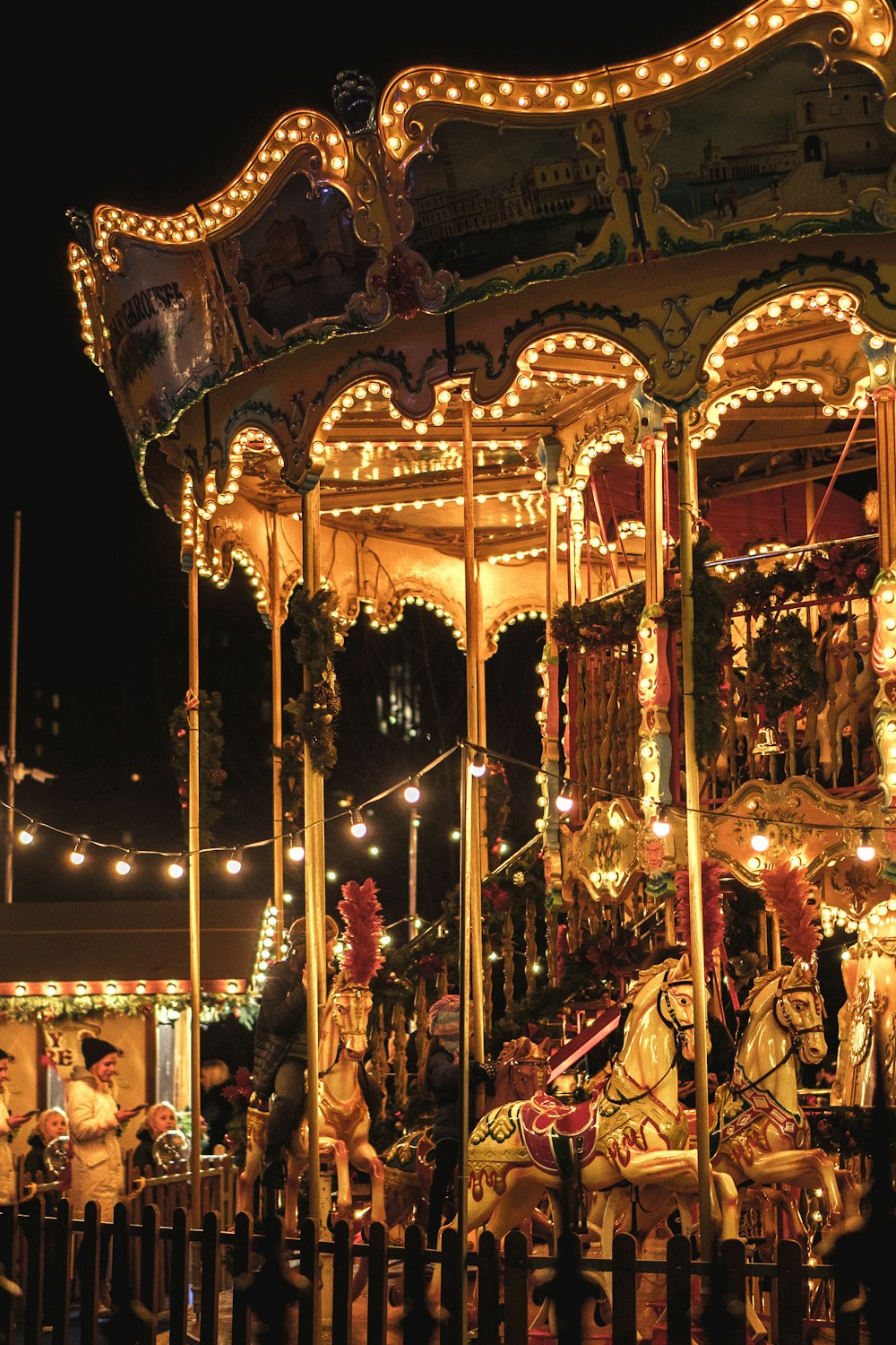 a merry go round is lit up at night