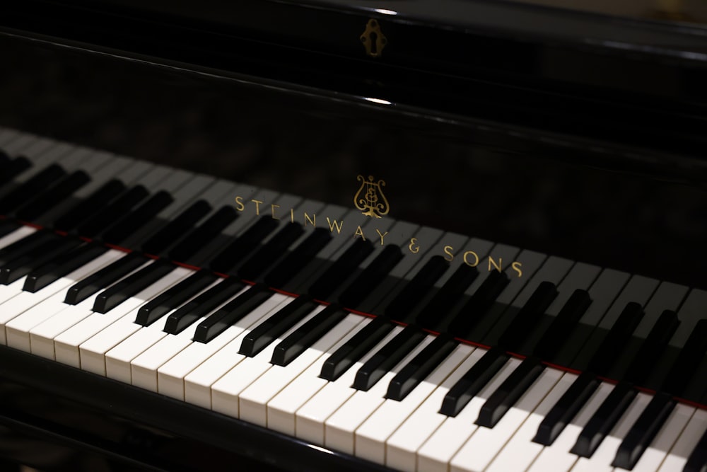 a close up of a piano with the name stein & sons on it