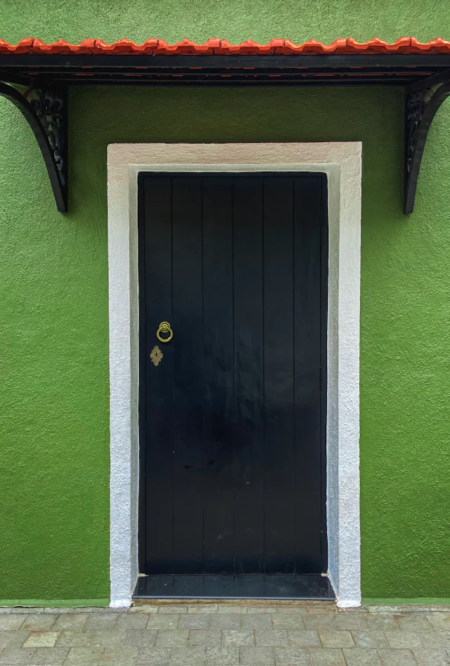 A green Portuguese-style doorway in Fontainhas, Panjim