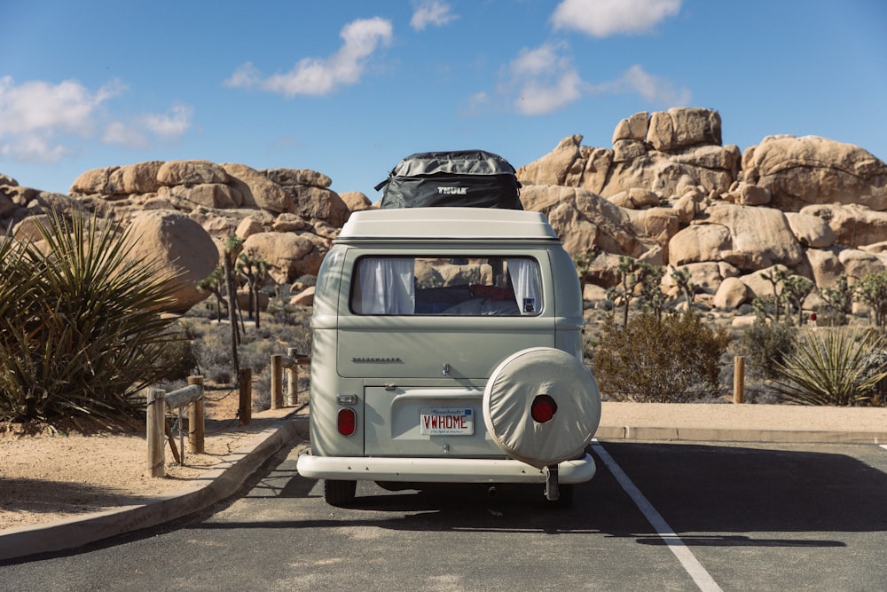 an old vw bus parked in a parking lot