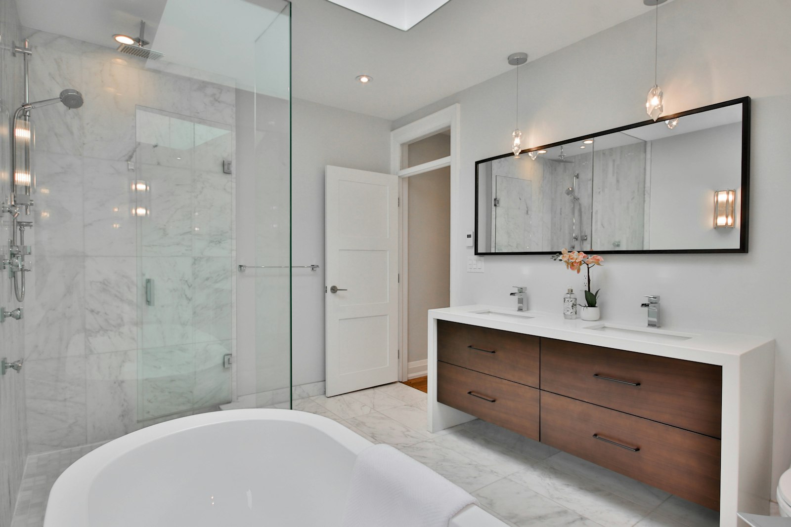 A bathroom with a freestanding tub and walk-in shower