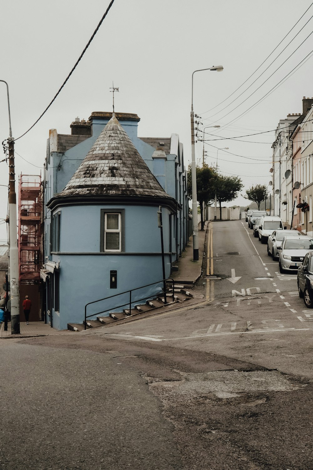 a blue building on the corner of a street