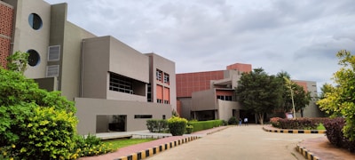 a building that has a lot of trees in front of it