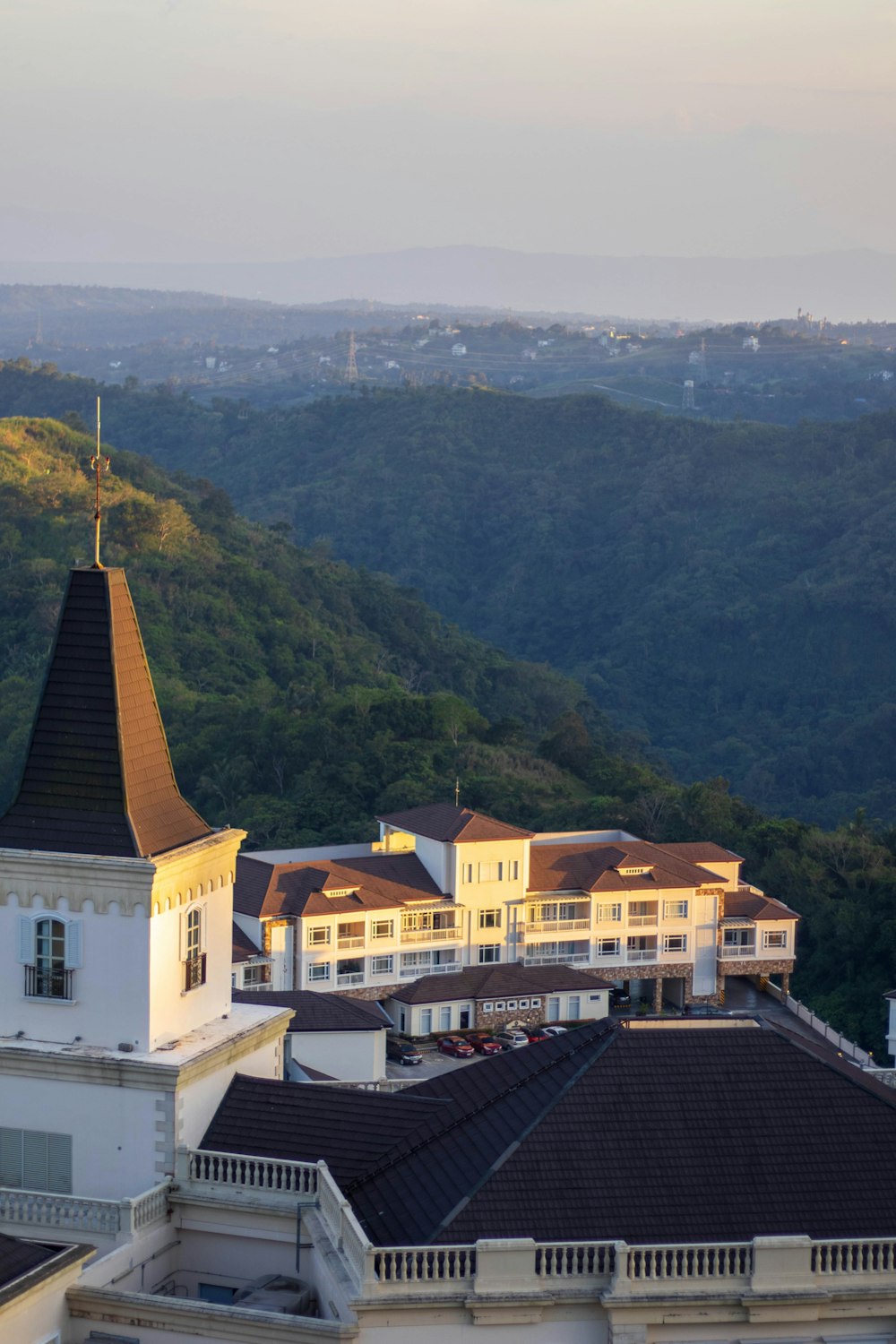 a building with a steeple on top of a hill