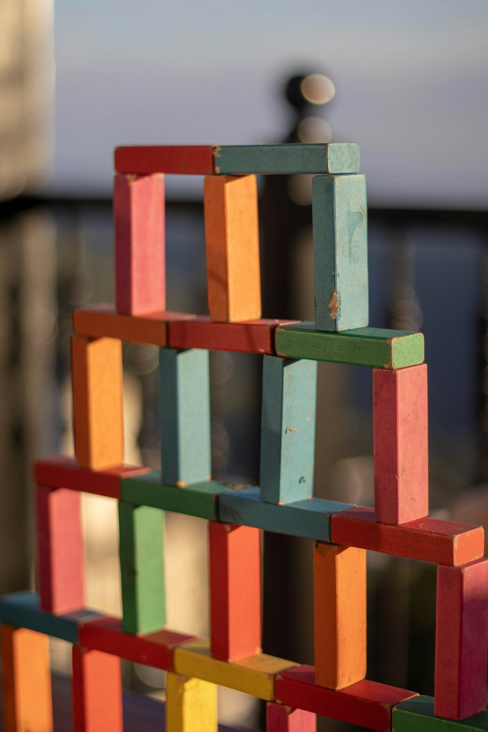 a multicolored building made of wooden blocks