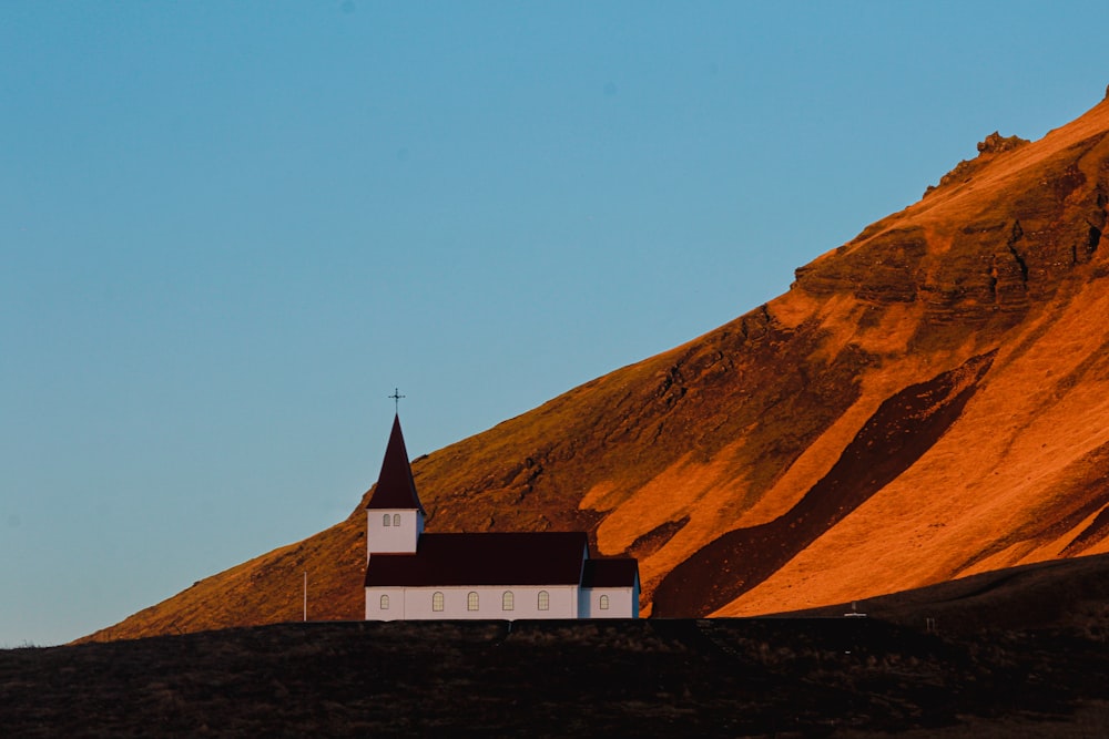 a church on a hill with a sky background
