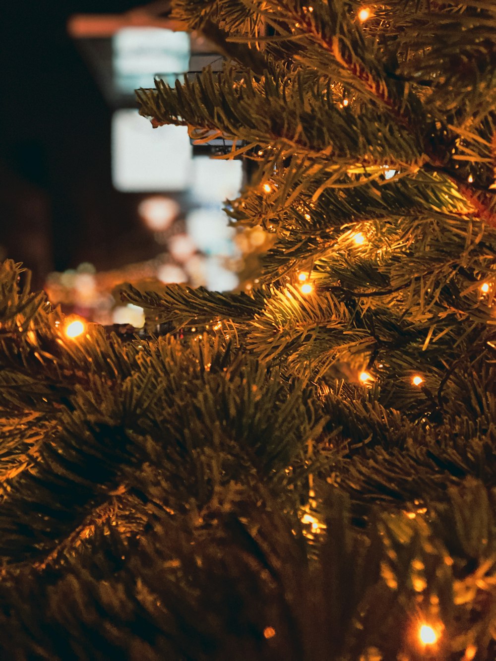 a close up of a christmas tree with lights