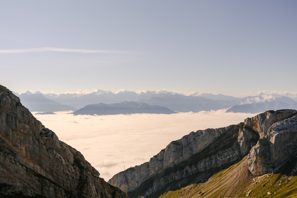 a view of a mountain range with low lying clouds