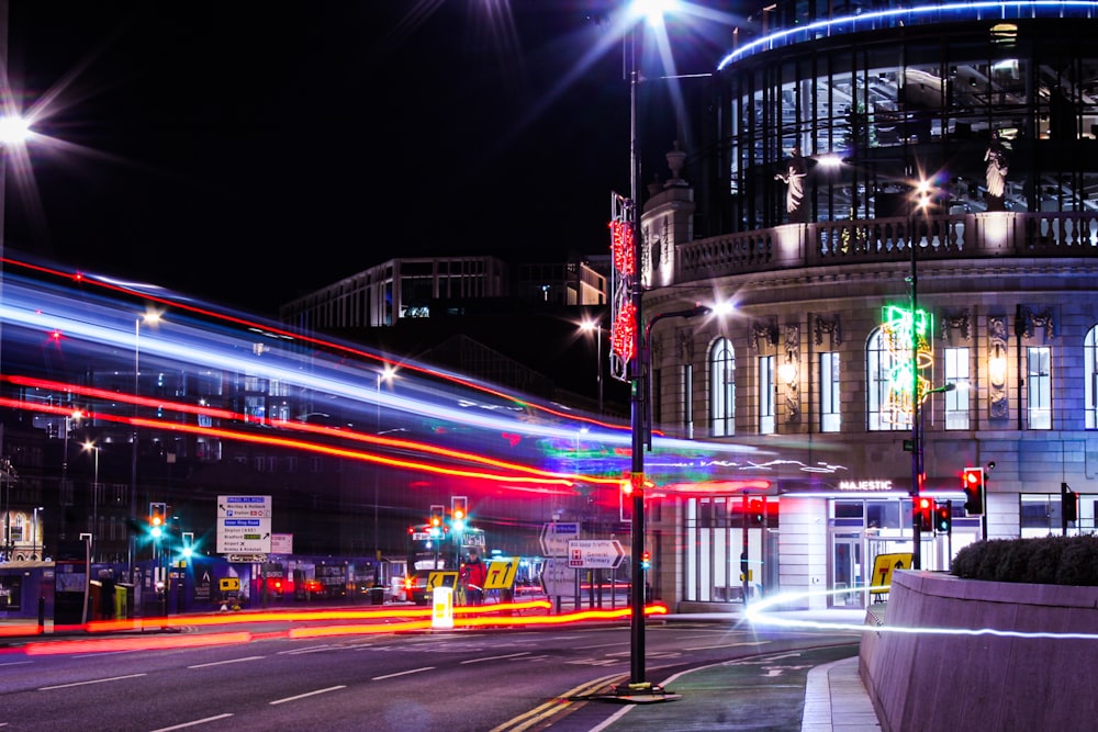 a city street filled with traffic and lights at night