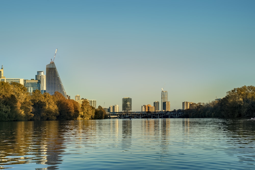 a body of water surrounded by tall buildings