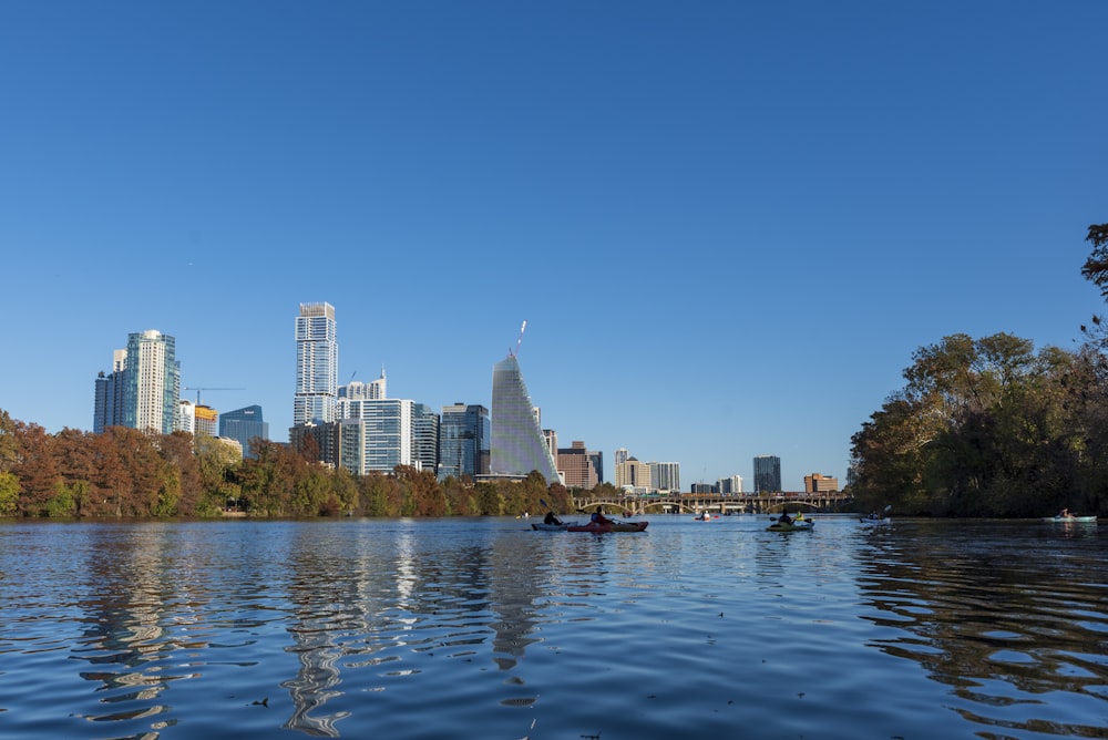 a body of water with a city in the background