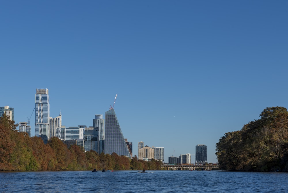 a body of water with a city in the background