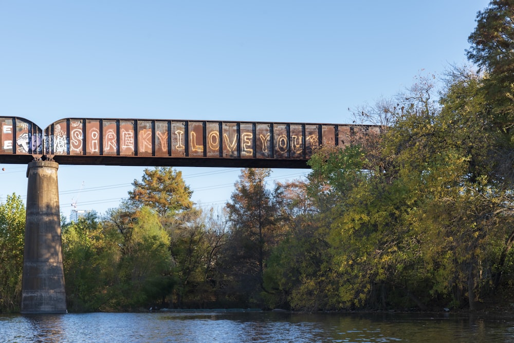 a train crossing a bridge over a river