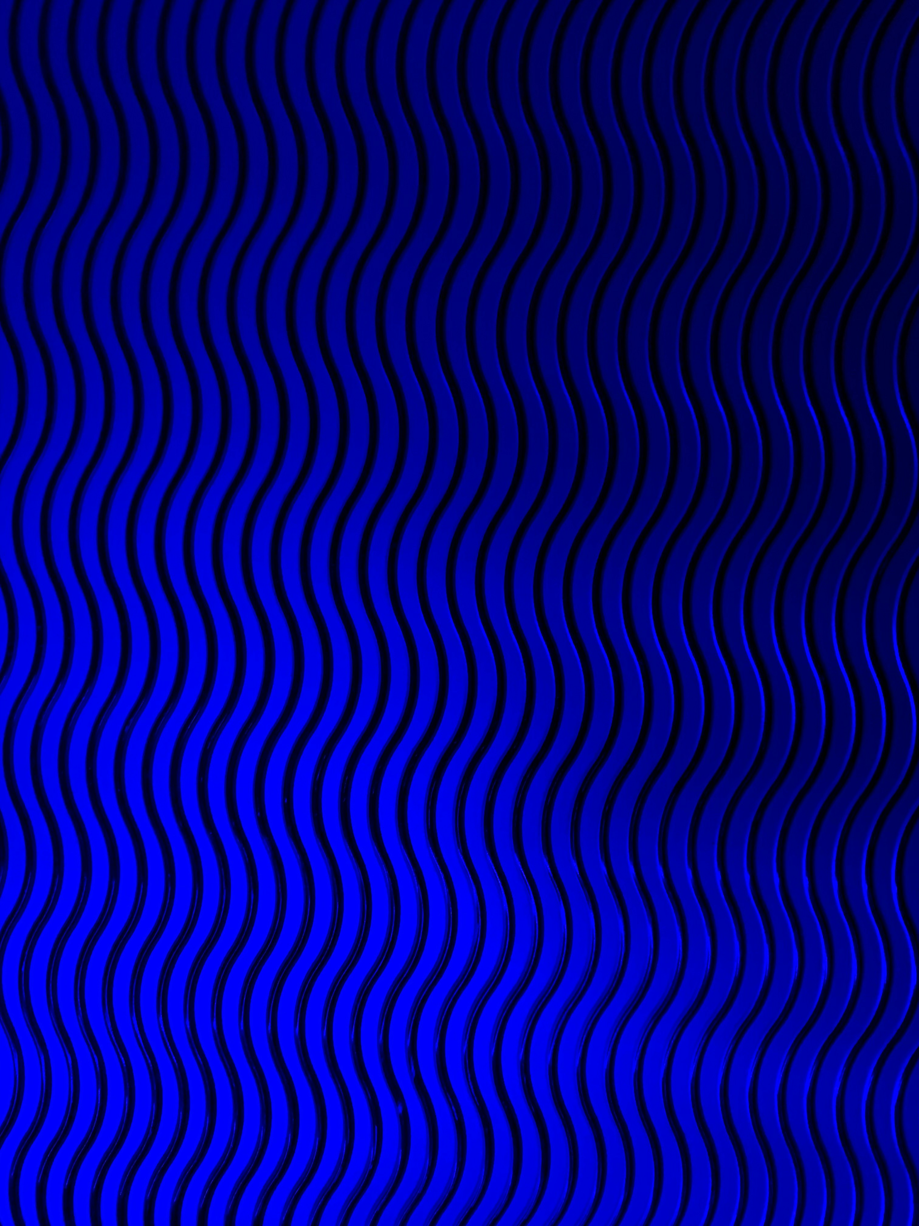 a dark blue background with wavy lines