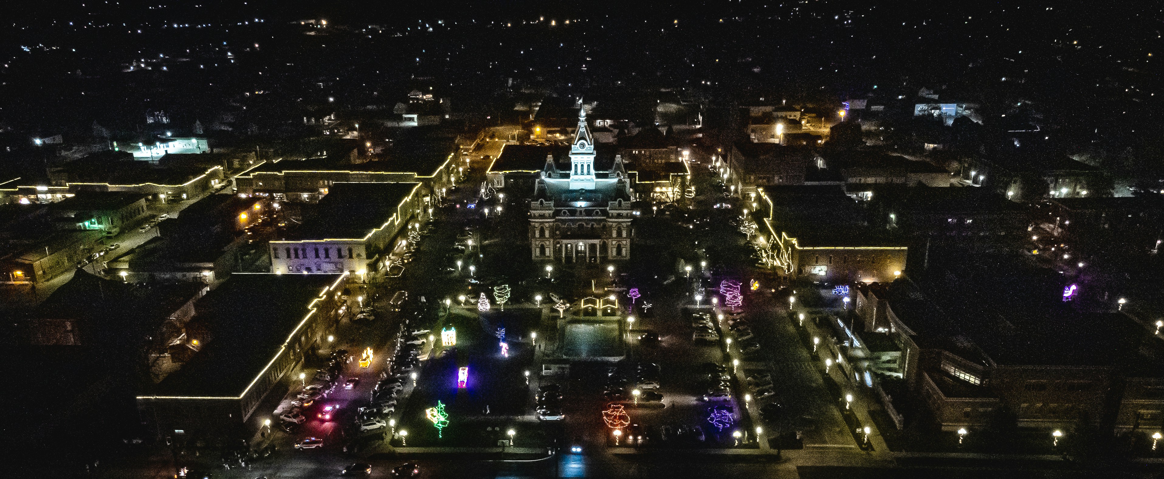 an aerial view of a city at night